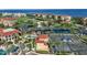 This scenic aerial view highlights resort-style amenities, including tennis courts and ponds at 98 Vivante Blvd # 9834, Punta Gorda, FL 33950