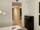 Bedroom with hall access and mirrored closet doors and a chest of drawers at 98 Vivante Blvd # 9834, Punta Gorda, FL 33950