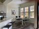 Bright dining area features a modern table, pendant lighting, and large windows offering natural light at 98 Vivante Blvd # 9834, Punta Gorda, FL 33950