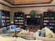 Relax in the cozy lounge area with comfortable seating, bookshelves, and a large TV for entertainment at 98 Vivante Blvd # 9834, Punta Gorda, FL 33950