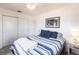 Bright bedroom with an ceiling fan, closet, and neutral colors at 11105 Pendleton Ave, Englewood, FL 34224