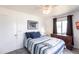 Charming bedroom with a classic dresser, soft carpet, and ample natural light at 11105 Pendleton Ave, Englewood, FL 34224