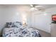 Bedroom featuring a queen-size bed, ceiling fan, closet and ample natural light at 11105 Pendleton Ave, Englewood, FL 34224