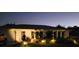 Single-story home featuring manicured landscaping and exterior lighting adding charm and curb appeal at 11105 Pendleton Ave, Englewood, FL 34224