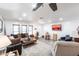 Spacious living room with neutral colors, wood flooring, and a ceiling fan at 11105 Pendleton Ave, Englewood, FL 34224