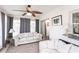 Inviting sunroom with tiled floors, lots of windows and natural light, ceiling fan, and comfortable seating at 11105 Pendleton Ave, Englewood, FL 34224