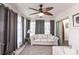 Cozy sunroom with large windows, comfortable seating, and a ceiling fan at 11105 Pendleton Ave, Englewood, FL 34224