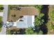 Bird's eye view of a home featuring a long driveway and verdant surrounding landscaping at 11136 Grapefruit Ln, Punta Gorda, FL 33955