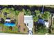 Aerial view of a well-maintained home with manicured landscaping and a long driveway at 11136 Grapefruit Ln, Punta Gorda, FL 33955