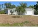 Charming single-Gathering home featuring a spacious front yard and a two-car garage at 11136 Grapefruit Ln, Punta Gorda, FL 33955