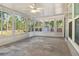 The bright lanai offers nature views through an abundance of windows at 11136 Grapefruit Ln, Punta Gorda, FL 33955