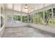 The bright lanai offers nature views through an abundance of windows at 11136 Grapefruit Ln, Punta Gorda, FL 33955