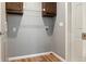 The laundry room features wood cabinets and a white door at 11136 Grapefruit Ln, Punta Gorda, FL 33955