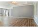 Spacious living room featuring wood floors, modern neutral paint, and abundant natural light at 11136 Grapefruit Ln, Punta Gorda, FL 33955