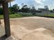 Large, buildable lot with ample space for outdoor activities, surrounded by lush greenery and fenced-in backyard at 112 Cougar Way, Rotonda West, FL 33947