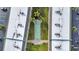 Aerial view of the condo complex's shuffleboard court and grassy area at 150 Harborside Ave # 134, Punta Gorda, FL 33950
