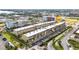 Aerial view showcases condo community, surrounded by tropical landscaping and bay views at 150 Harborside Ave # 134, Punta Gorda, FL 33950