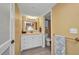 Well-lit bathroom featuring a vanity with a mirror, and an adjacent shower/tub combo at 150 Harborside Ave # 134, Punta Gorda, FL 33950