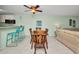 Charming dining area with wooden table set, kitchen bar, and neutral decor at 150 Harborside Ave # 134, Punta Gorda, FL 33950