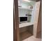 A versatile home office nook offers a compact design, maximizing space with built-in shelves and a functional work area at 150 Harborside Ave # 134, Punta Gorda, FL 33950