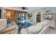 Cozy living room featuring tile flooring, comfortable couches, and decor at 150 Harborside Ave # 134, Punta Gorda, FL 33950