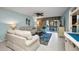 Bright living room with tile flooring, comfortable seating, and sliding glass doors at 150 Harborside Ave # 134, Punta Gorda, FL 33950