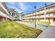 Exterior shot of shuffleboard courts surrounded by lush landscaping and the condos in the background at 150 Harborside Ave # 134, Punta Gorda, FL 33950