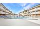 Community swimming pool surrounded by lounge chairs and landscaping at 150 Harborside Ave # 134, Punta Gorda, FL 33950