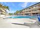 Relaxing swimming pool with lounge chairs for residents' leisure at 150 Harborside Ave # 134, Punta Gorda, FL 33950