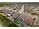 A high-angle shot showcases a neighborhood with screened-in pools and well-maintained yards at 15193 Mille Fiore Blvd, Port Charlotte, FL 33953