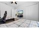 Bedroom with two beds, ceiling fan, tv, and double door closet at 15193 Mille Fiore Blvd, Port Charlotte, FL 33953