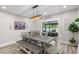 Bright dining room featuring a sliding glass door leading to an outdoor living space at 15193 Mille Fiore Blvd, Port Charlotte, FL 33953