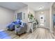 Warm and inviting entryway showcasing modern flooring, stylish decor, and a bright front door at 15193 Mille Fiore Blvd, Port Charlotte, FL 33953