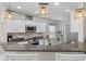 Open kitchen features granite countertops, stainless appliances, and modern lighting at 15193 Mille Fiore Blvd, Port Charlotte, FL 33953
