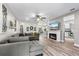 Open concept living space features a modern fireplace, bar seating, and an airy design at 15193 Mille Fiore Blvd, Port Charlotte, FL 33953