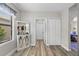 Living Space features wood flooring, mini-bar and decorative window at 15193 Mille Fiore Blvd, Port Charlotte, FL 33953