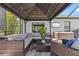 Outdoor living space with a gazebo, hot tub, and seating area, creating a relaxing retreat at 15193 Mille Fiore Blvd, Port Charlotte, FL 33953