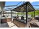 Outdoor living space with a gazebo, pool and hot tub, perfect for relaxation and entertainment at 15193 Mille Fiore Blvd, Port Charlotte, FL 33953