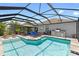 This house features a luxurious screened-in pool area with an outdoor kitchen and seating at 15193 Mille Fiore Blvd, Port Charlotte, FL 33953