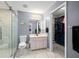 This main bathroom features a walk in shower, vanity, and a walk in closet at 1773 Portage St, North Port, FL 34287