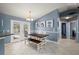 Dining area featuring tile flooring, a dining table, and views of the outdoor pool area at 1773 Portage St, North Port, FL 34287