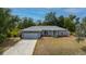 Charming single-story home with a two-car garage and well-maintained landscaping at 1773 Portage St, North Port, FL 34287