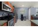 This kitchen features stainless steel appliances, tile floors and wood cabinets at 1773 Portage St, North Port, FL 34287