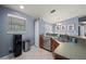 This kitchen features stainless steel appliances, tile floors, and a pass through to the dinette at 1773 Portage St, North Port, FL 34287