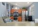 Modern kitchen featuring stainless steel appliances, wood cabinets, and an open layout at 1773 Portage St, North Port, FL 34287