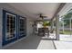 Spacious outdoor dining area on the covered patio at 1773 Portage St, North Port, FL 34287