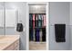 This walk-in closet contains built in shelving and hanging rods for maximum storage at 1773 Portage St, North Port, FL 34287