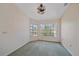 Bright den area filled with natural light from the multiple large windows at 18135 Lake Worth Blvd, Port Charlotte, FL 33948