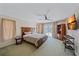 The main bedroom features a ceiling fan and sliding glass doors to the pool area at 18135 Lake Worth Blvd, Port Charlotte, FL 33948