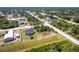 Aerial view of the property showing the lot and surrounding wooded areas at 1816 Braddock Ave, North Port, FL 34288